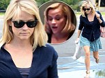 Met-regret? Reese Witherspoon looks glum as she dodges a puddle in LA... after THAT drunken Instagram video from the Gala
