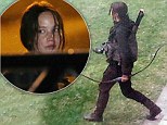 She¿s returning to her role as heroine Katniss Everdeen in Hunger Games. And Jennifer Lawrence showed that she meant business as she clutched a large black bow.