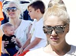 She's a soccer mom! Gwen Stefani shows off her adorable baby boy Apolo while she and Kingston watch Zuma play in a game