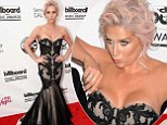 That was close! Kesha adjusts mermaid gown after her cleavage very nearly spills out of it at Billboard Music Awards