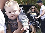 A star is born! Fergie and Josh Duhamel are upstaged by their adorable and inquisitive son Axl as they return home from fun family day out