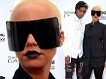 Shady lady! Amber Rose does her best futuristic robot impression on the Billboard Music Awards red carpet with husband Wiz Khalifa