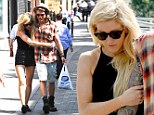 Very close: Ellie Goulding and Dougie have appeared to confirm they are dating after recent pictures show them to look more loved-up than ever before