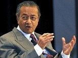 Mahathir (above, left) said the missing plane may have had its MAS airline markings removed and the Australian co-ordinated search out of Perth for debris was 'a waste of time and money'.
