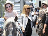 Priceless: Rachel Zoe son's Skyler was too cute for words as he rode a pony at the Farmer's Market in Beverly Hills, California on Sunday