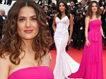 Haute, haute, haute! Salma Hayek, left, dazzled in a magenta gown, as Eva Longoria, right, looked lovely in an angelic white dress, as the two attended the Saint Laurent premiere during the 67th Annual Cannes Film Festival in Cannes, France on Saturday