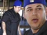 Anything for Kim! Rob Kardashian steps out in public for the first time in months as he and mother Kris Jenner fly out for his sister's wedding