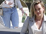 Shrinking Hilary Duff reveals a peek of toned tummy as she grabs healthy green juice drink at Starbucks