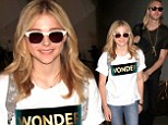 Talk about a big brother! Chloe Grace Moretz is dwarfed by sibling Trevor at airport as they jet out to Cannes