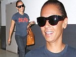 Fresh-faced Mel B jets home to LA sporting an AC/DC T-shirt ahead of her 39th birthday amid reports she's in talks for the final X Factor spot