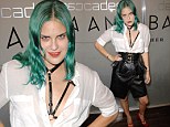 Taking after her sister! Tallulah Wills goes braless in leather harness and corset at fashion event