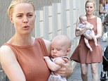 Melissa George looks like a proud mother as she shows off four month old son Raphael while strolling in Italy