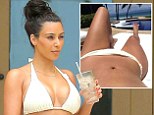 She's clearly eager to share the physical evidence of her wedded bliss. Kim Kardashian uploaded not one but two bikini body selfies on Thursday as she reclined outside a private villa in Punta Mita, Mexico, sunning her washboard tummy.