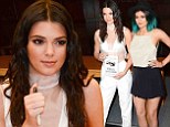 Risque: Kendall Jenner teamed a shiny white bra top with a pair of high-waisted dress pants at a book signing in Los Angeles on Thursday with her sister Kylie