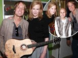 Hearts of gold! Keith Urban and Nicole Kidman donate signed guitar to Melbourne children's hospital during special star visit