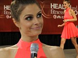 She's a tangerine dream! Maria Menounos is striking in a neon orange mini dress as she promotes new diet book