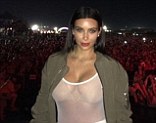Marriage hasn't tamed her! Kim Kardashian exposes ample bosom in completely see-through top while supporting Kanye at music festival