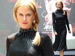 Perky Nicole Kidman covers up her ample cleavage two days after wearing a VERY low cut gown that stole the show