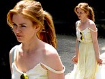 She's a ray of sunshine!  Isla Fisher looks cute in citrus as she hits the shops and does school run in lemon yellow dress