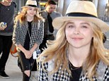 Chloe Moretz is a hip traveller donning a fedora and ripped jeans as she touches down in Toronto