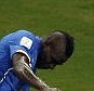 Heads up: Italy striker Mario Balotelli (left) scores second goal against England