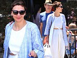 She's daring to bare! Maggie Gyllenhaal flashes a peaek of her midsection in two-piece white dress