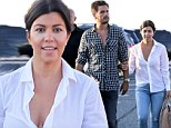 No sign of strife! Kourtney Kardashian and Scott Disick look blissfully happy as they stroll arm-in-arm despite reports of fight on reality show