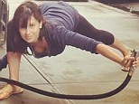 Run out of ideas? Makeup-free Hilaria Baldwin shows off cleavage while holding water hose in bizarre yoga pose