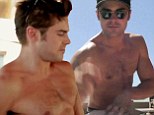 Topless Zac Efron puts his sculpted physique on display while making skateboards in new charity video