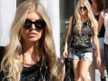 Incredible shrinking woman! Fergie, 39, shows off her svelte figure in daisy dukes and black vest alongside gal pals