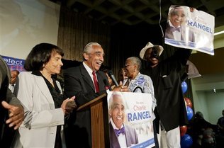  
Accompanied by his wife Alma Rangel, left, Rep. Charles Rangel, D-N.Y., speaks at his primary election night gathering, Tuesday, June 24, 2014, in New York.  Rangel is seeking his 23rd term against opponent state Sen. Adriano Espaillat. Election officials told The Associated Press Tuesday night that the Democratic primary between Rep. Charles Rangel and state Sen. Adriano Espaillat in New York's 13th congressional district remains too close to call, with an undetermined number of absentee and provisional ballots outstanding. 

