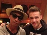 Exciting times: Pharrell Williams revealed he's been hanging out at the studio with One Direction star Liam Payne (right) ...and says he'd be up for a collaboration with the band