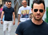 Justin Theroux lightens up his trademark dark style with white jeans during NY stroll with famed photographer Terry Richardson