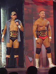 Cade with his former tag team partner Trevor Murdoch as the World Tag Team Champions.