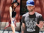 Similar styles: Behati Prinsloo, left, and her fiance Adam Levine, right, coordinated in edge ensembles as they left their hotel in New York's Soho neighbourhood on Sunday