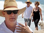 Turner and pooch! Tom Hanks and wife Rita Wilson take their adorable dog for a walk on the beach in Malibu