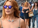 Are they Brazil nuts? Lindsay Lohan and sister Ali look sad as they leave cafe in New York after watching Germany crush World Cup hosts