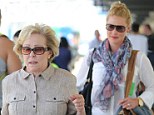 Following in her mother's footsteps: Katherine Heigl let her mother Nancy lead the way at an airport in Los Angeles on Tuesday