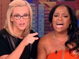 Sherri Shepherd sheds TEARS during first day back at The View since being fired... as Jenny McCarthy announces new gig that will compete with chat fest