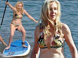 Real Housewives¿ Shannon Beador showcases her bikini body as she goes paddle boarding with husband David during Hawaiian getaway