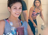 Vanessa Hudgens flashes her flat tummy in tiny crop top as she hits up a gruelling indoor cycling class with sister Stella