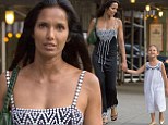 Top Mom! Padma Lakshmi holds her daughter Krishna's hand while dressed in stylish black dress