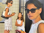 Katie Holmes and daughter Suri dress alike in fresh white summer dresses while dashing into NYC subway
