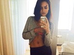 Abs of steel! Victoria's Secret model Shanina Shaik shows off her toned stomach in a casual selfie