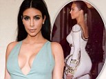 Workout inspiration: On Tuesday, Kim Kardashian shared a throwback image in a tight white dress, captioned, 'Throwback to a few years ago #SkinnyDays #OnTheTreadmillRightNOW'