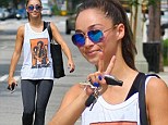 Peace, baby! Jesse Metcalfe's girlfriend Cara Santana rocks a Jimi Hendrix tank as she exits a gym in LA