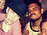 Party time: Chris Brown and Justin Bieber were pictured together on Tuesday night at a nightclub in West Hollywood, California