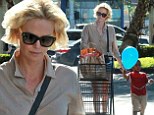 She's a trolley dolly! Charlize Theron looks like a pro as she pushes her own shopping cart on grocery run with son Jackson