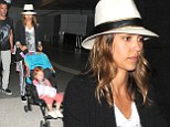Home time: The actress arrives back in LAX from her family holiday