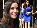 Liv Tyler shows off her long slim legs and svelte figure in clinging blue and black mini dress